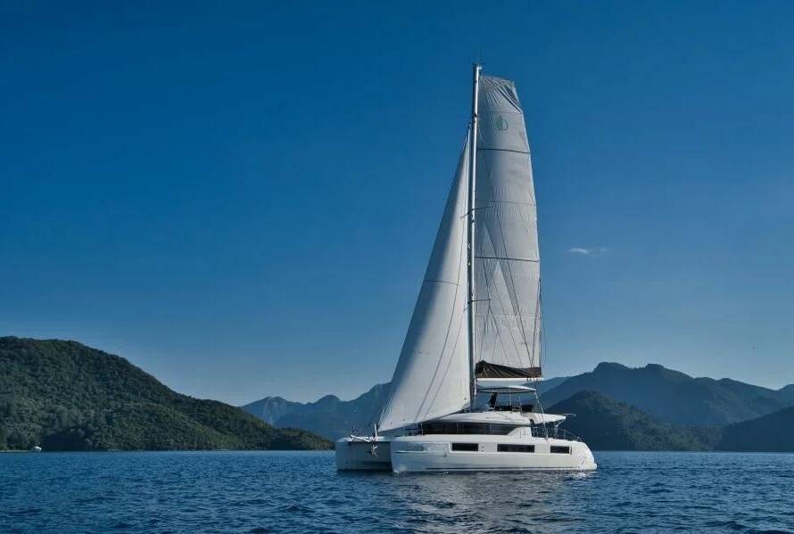 Modern Greece catamaran charter yacht at Rhodes marina before a Greek Islands sailing holiday.